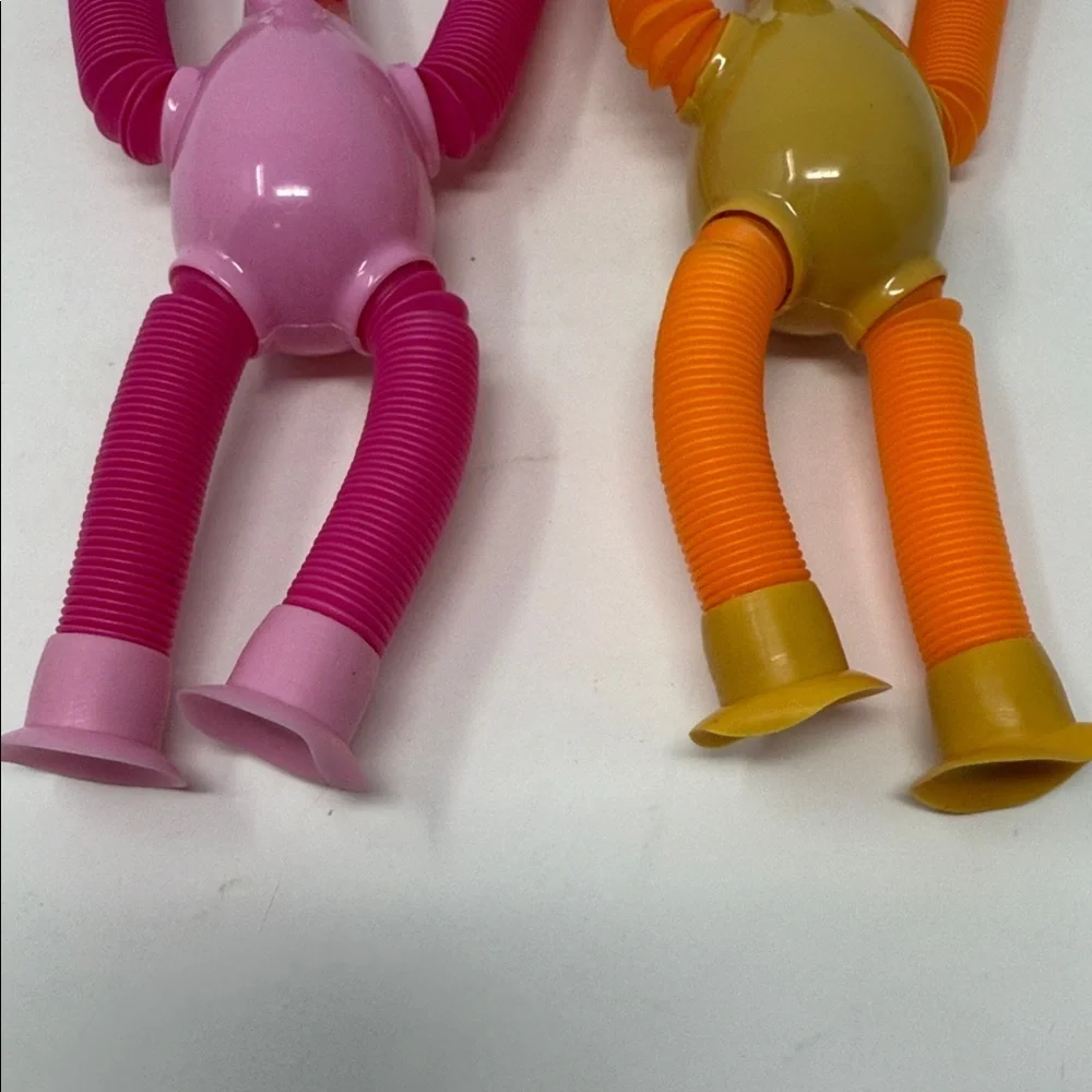 2 Colorful Suction Cup Giraffe Stretch Toys for Kids Pink and Orange NEW No tag